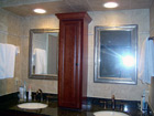 Bathroom remodel with wood, tile and marble