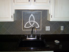 Kitchen with custom tile and fixtures